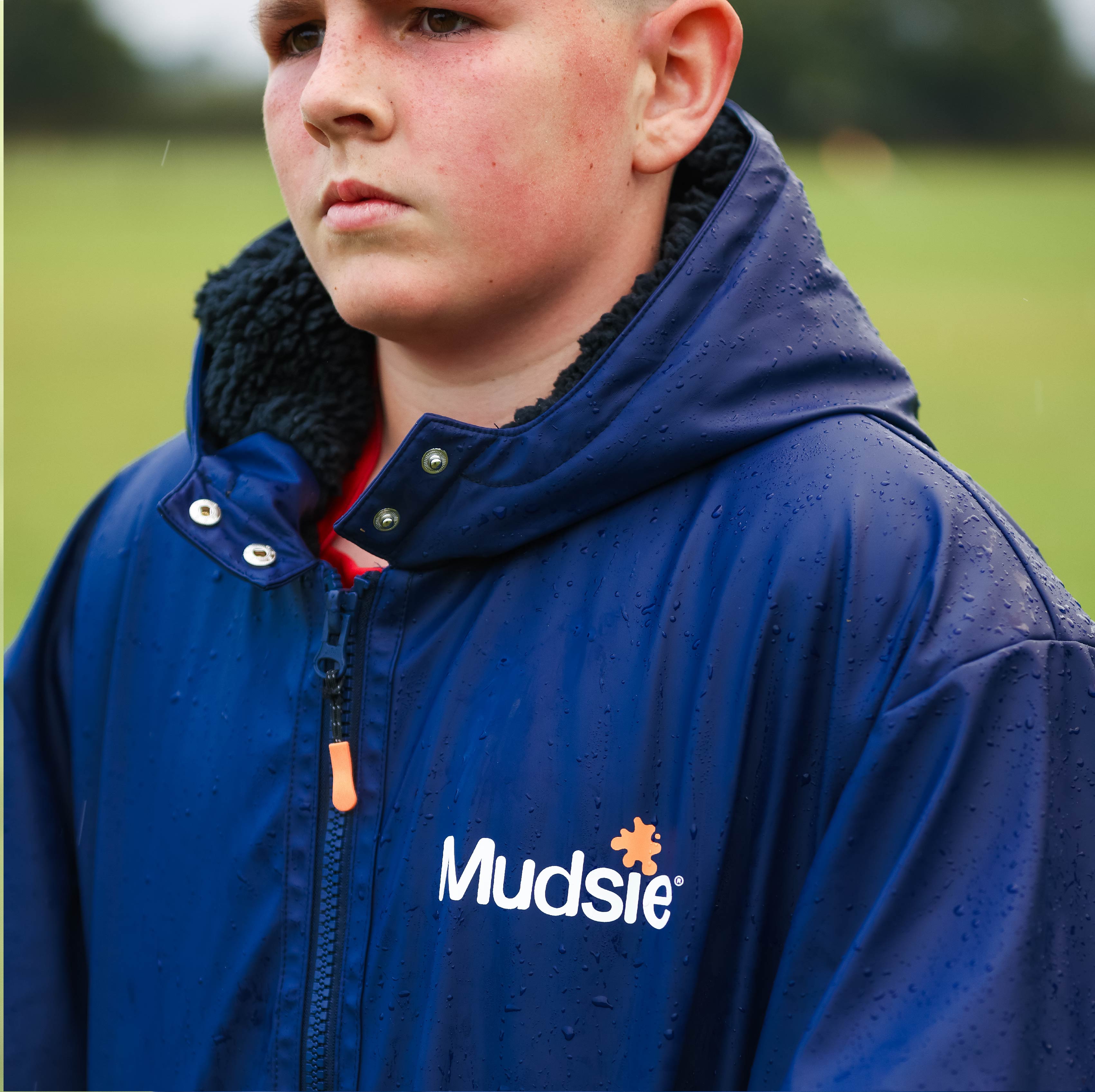 ORANGE LOGO MUDSIE COAT